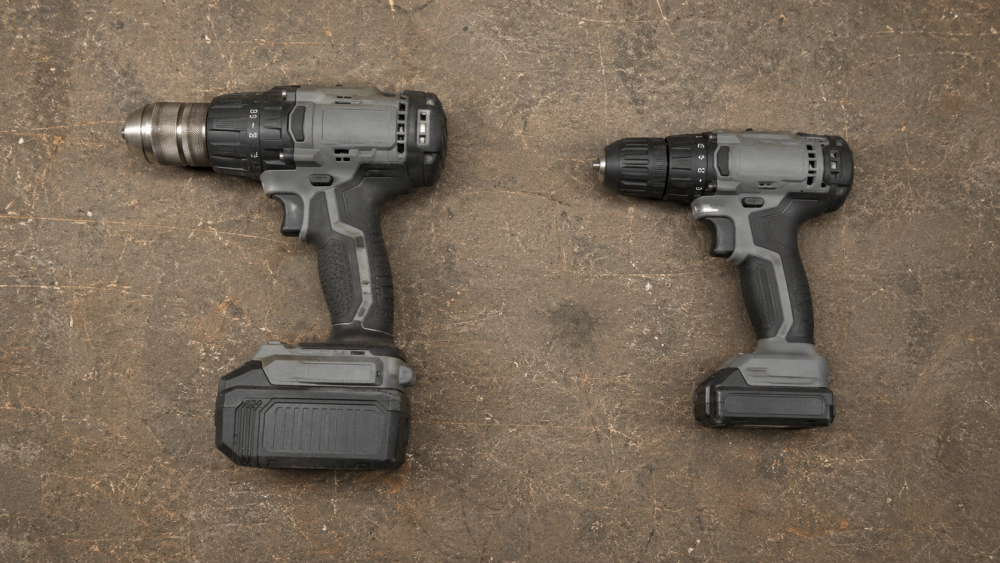 Two cordless drills side by side, one professional duty-rated and one lighter DIY grade